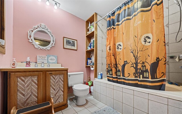 full bathroom featuring tile patterned flooring, vanity, toilet, and shower / bath combo with shower curtain