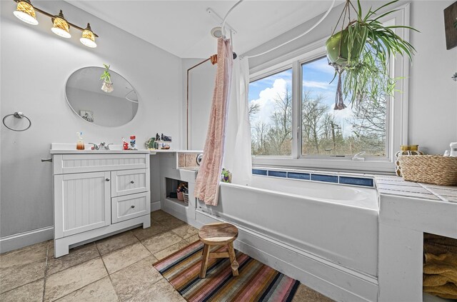 bathroom with vanity and a bathtub