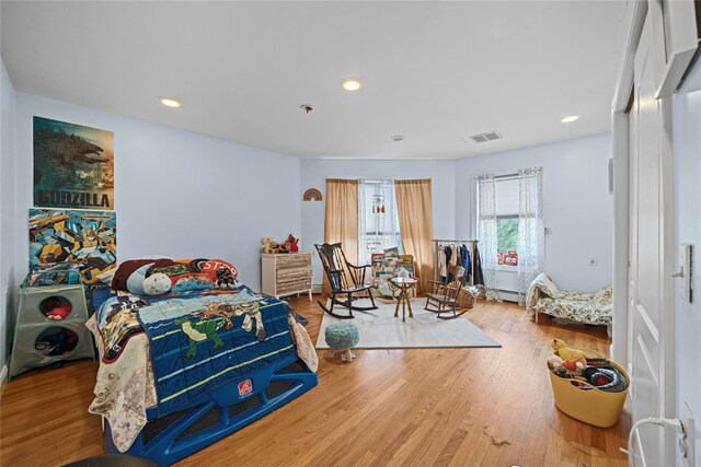 bedroom with wood-type flooring