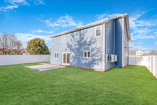 rear view of property with a patio area and a yard