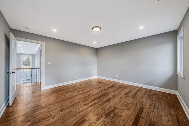 unfurnished room featuring hardwood / wood-style flooring