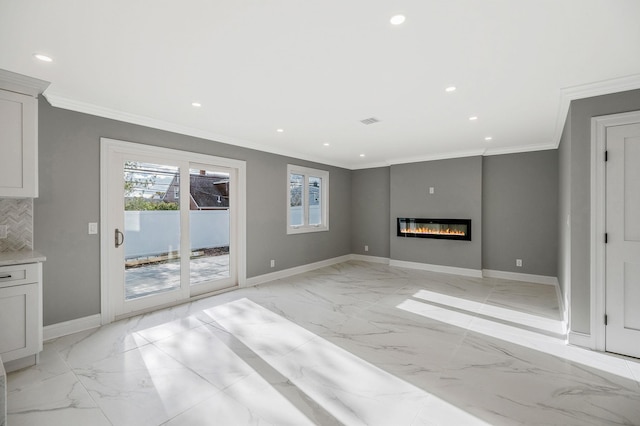 unfurnished living room with ornamental molding