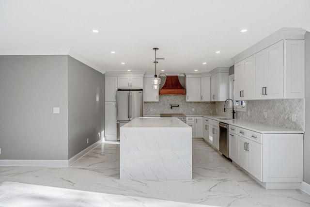 kitchen featuring pendant lighting, premium appliances, premium range hood, and a kitchen island