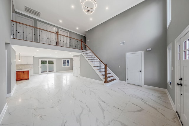 foyer entrance with a high ceiling