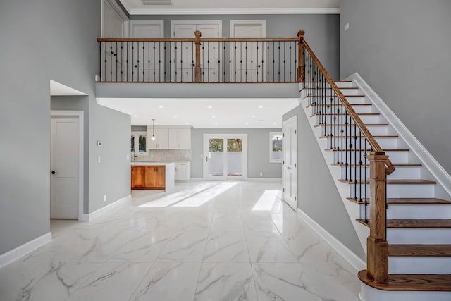 stairway featuring a high ceiling