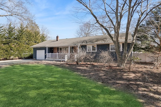 ranch-style house featuring a porch, dirt driveway, a front yard, an attached garage, and a chimney