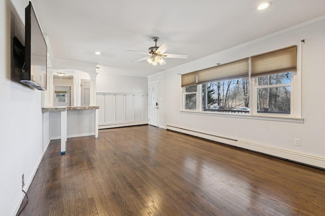 unfurnished living room featuring ceiling fan, a baseboard radiator, recessed lighting, ornate columns, and dark wood-style flooring