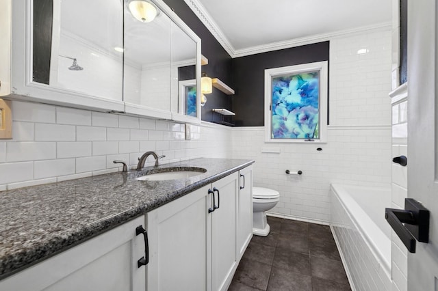 full bath featuring tile patterned floors, toilet, ornamental molding, tile walls, and vanity