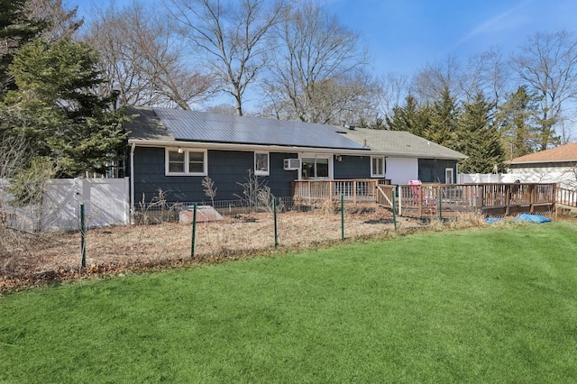 back of property featuring a yard, fence private yard, and a wooden deck