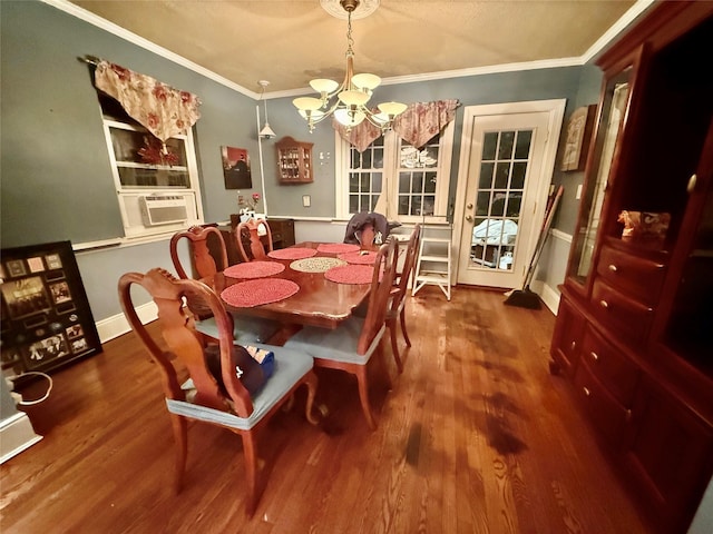 dining space with crown molding, hardwood / wood-style floors, cooling unit, and a chandelier