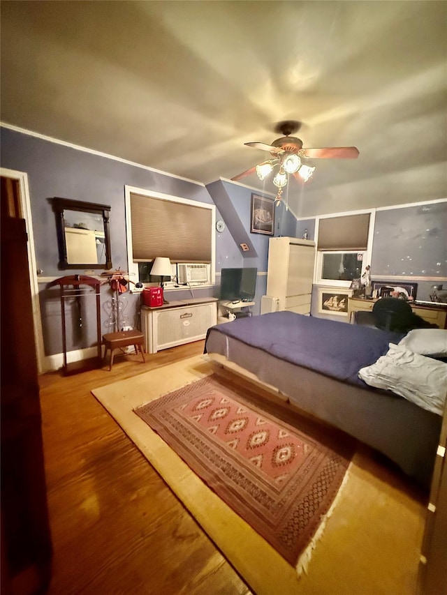 bedroom featuring ceiling fan and wood-type flooring