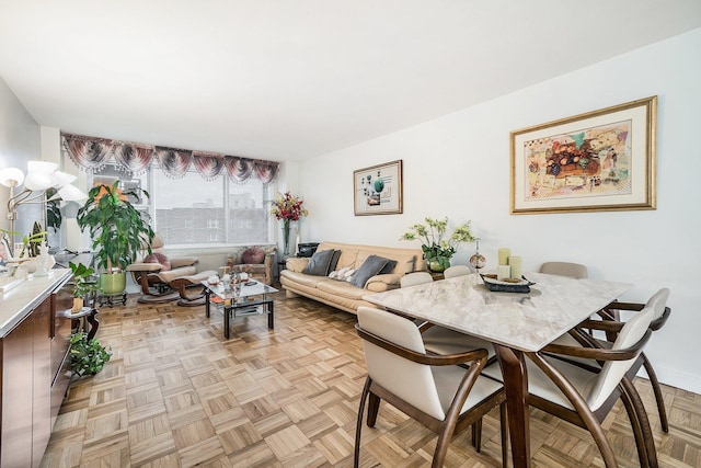 dining area featuring light parquet floors