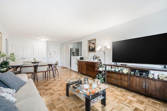 living room featuring light parquet flooring