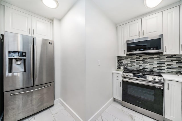 kitchen featuring backsplash, white cabinetry, and stainless steel appliances