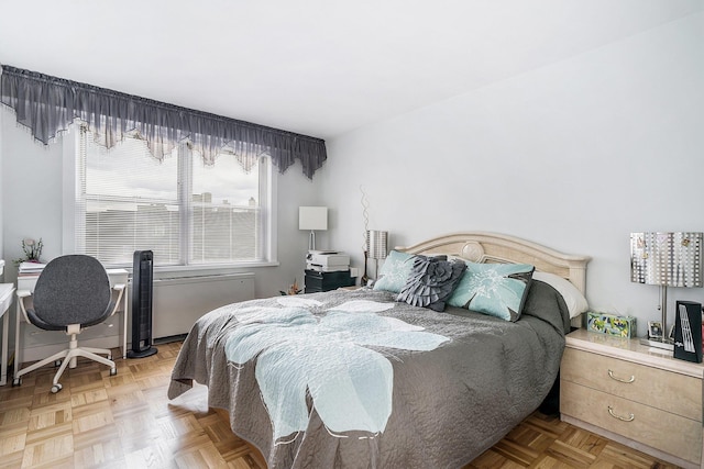 bedroom featuring parquet floors