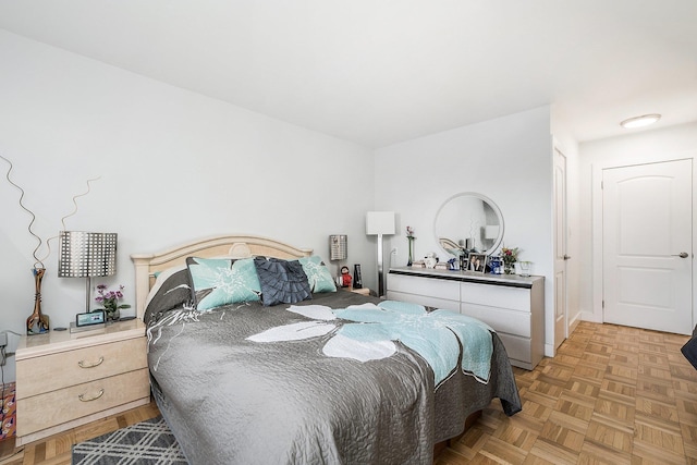 bedroom with light parquet floors