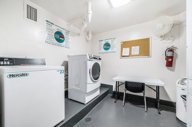 laundry area with washing machine and clothes dryer