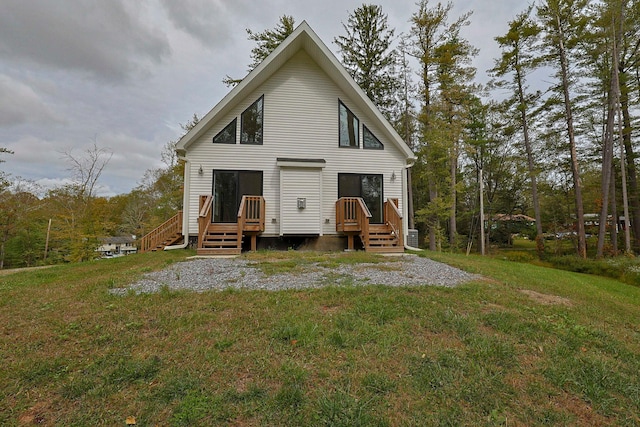 back of property featuring a lawn