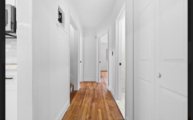 hallway featuring light hardwood / wood-style floors