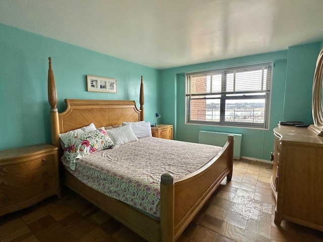 bedroom featuring radiator