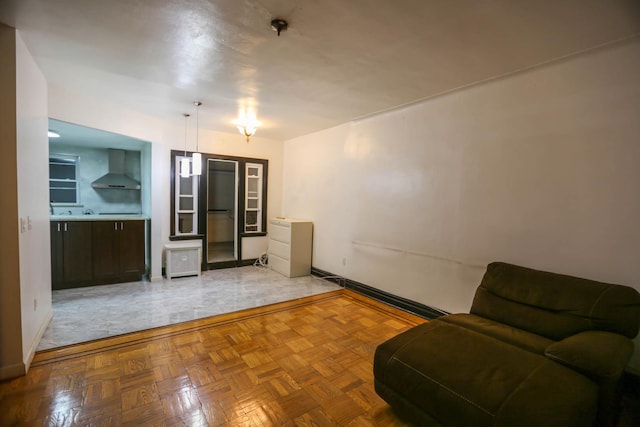 unfurnished living room with parquet floors