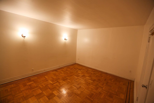 unfurnished room featuring parquet floors