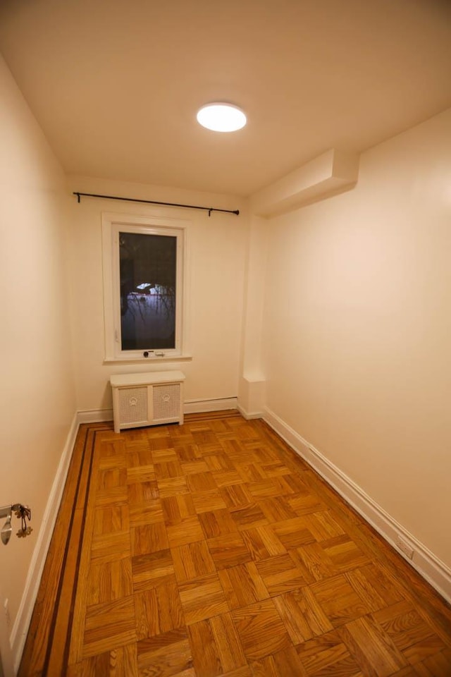 corridor featuring light parquet floors