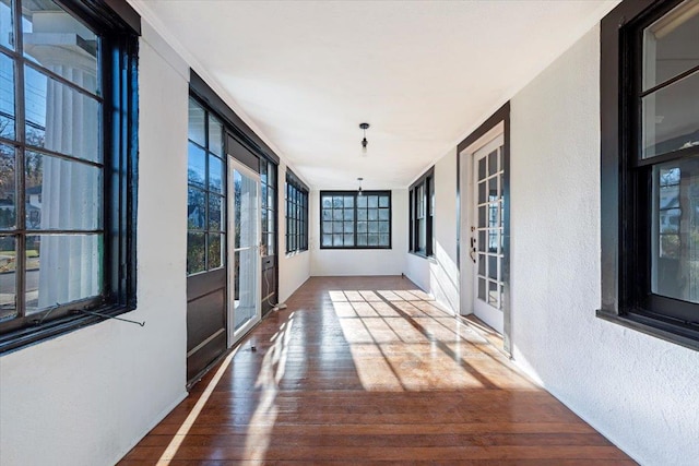 corridor featuring wood-type flooring