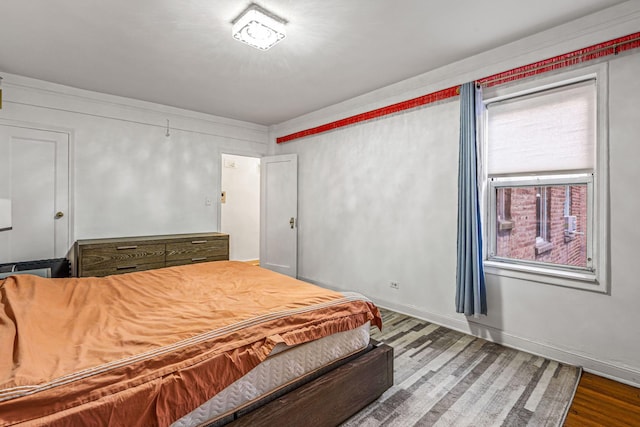 bedroom featuring hardwood / wood-style flooring