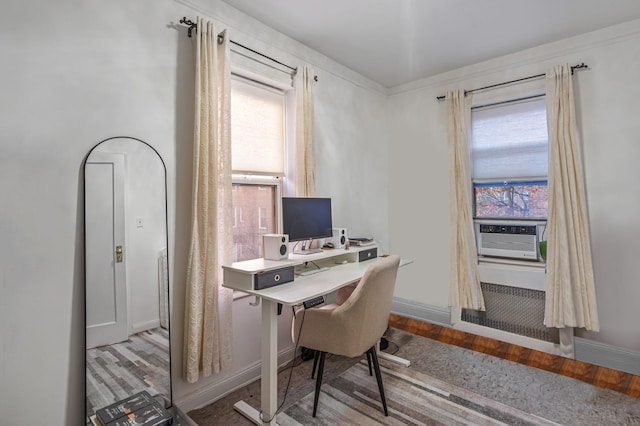 home office with light hardwood / wood-style floors and cooling unit