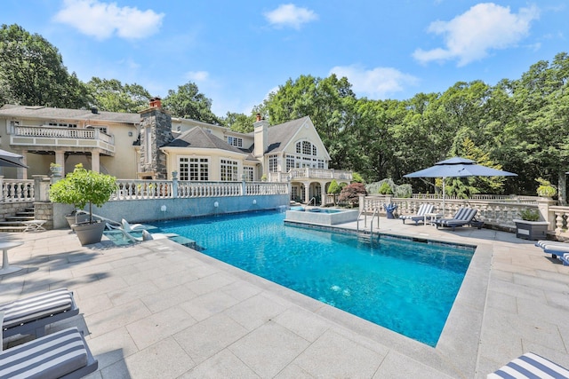 view of pool featuring a patio area