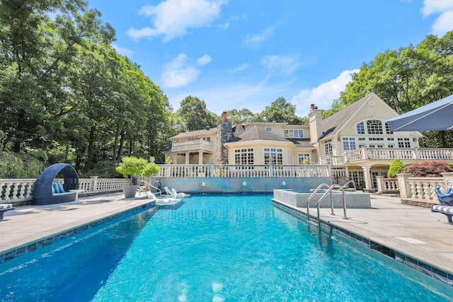 view of pool featuring a patio