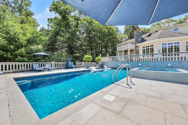 view of pool featuring a patio