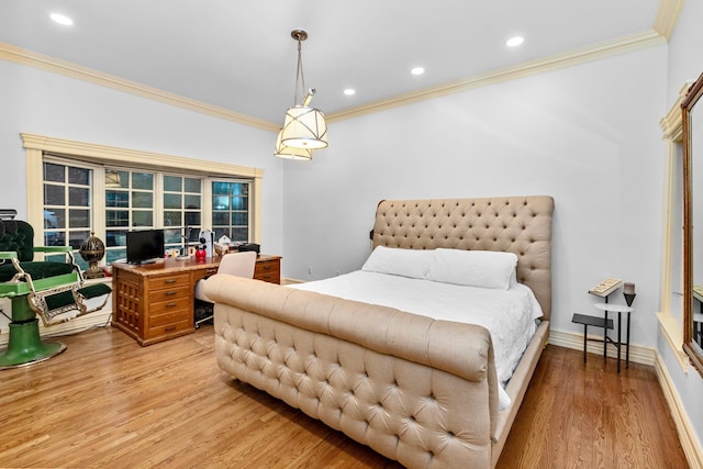 bedroom with light hardwood / wood-style flooring and ornamental molding