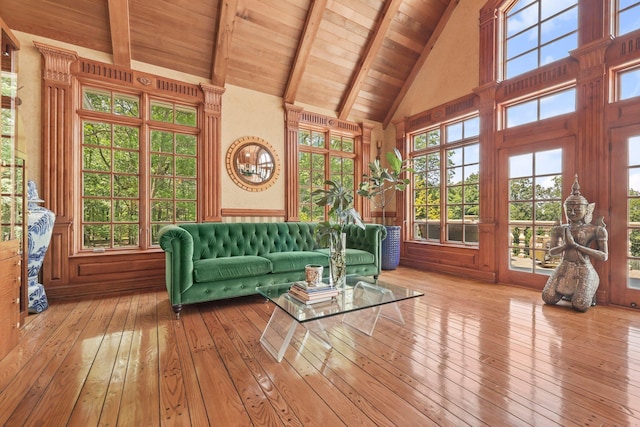 unfurnished sunroom with vaulted ceiling with beams and wood ceiling