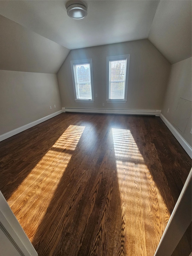 bonus room featuring dark hardwood / wood-style floors and lofted ceiling