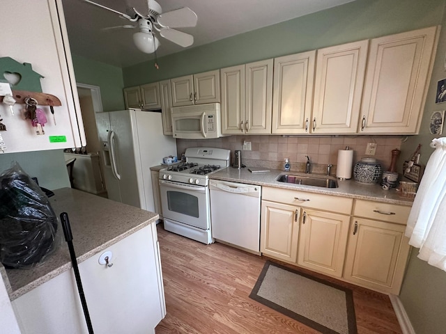 kitchen with ceiling fan, sink, tasteful backsplash, white appliances, and light wood-type flooring