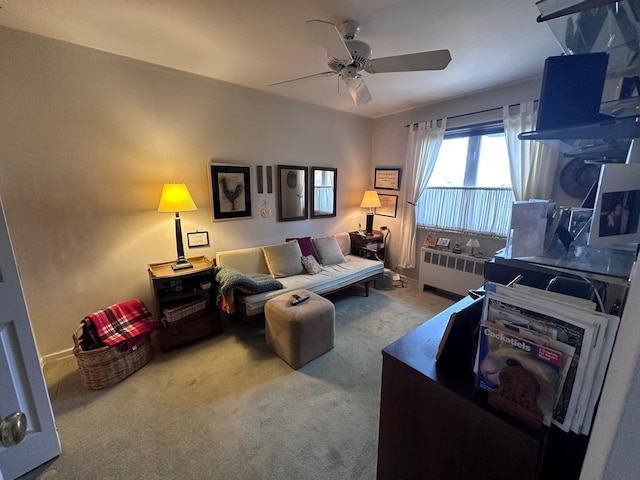 living room featuring radiator, ceiling fan, and light colored carpet