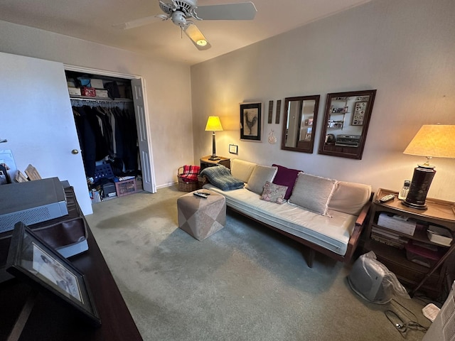 living room featuring carpet and ceiling fan