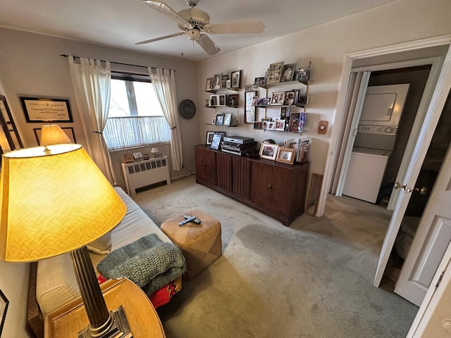 interior space with ceiling fan, radiator heating unit, and light colored carpet