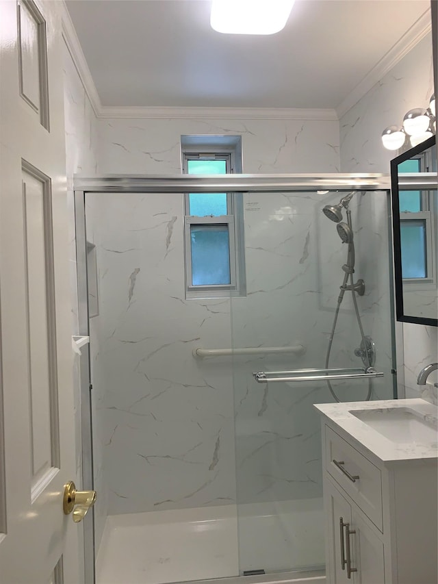 bathroom featuring vanity, an enclosed shower, and ornamental molding