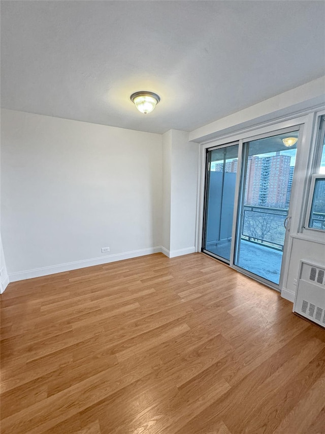 unfurnished room featuring light hardwood / wood-style flooring