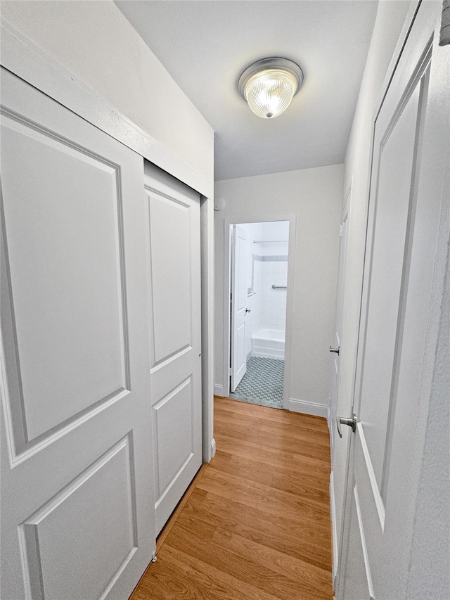 hallway featuring light wood-type flooring