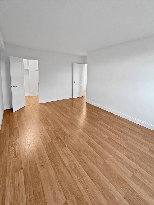 spare room featuring light hardwood / wood-style floors