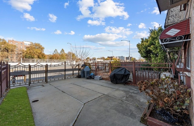 view of patio featuring a grill