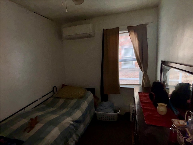 bedroom featuring a wall mounted AC, ceiling fan, and multiple windows