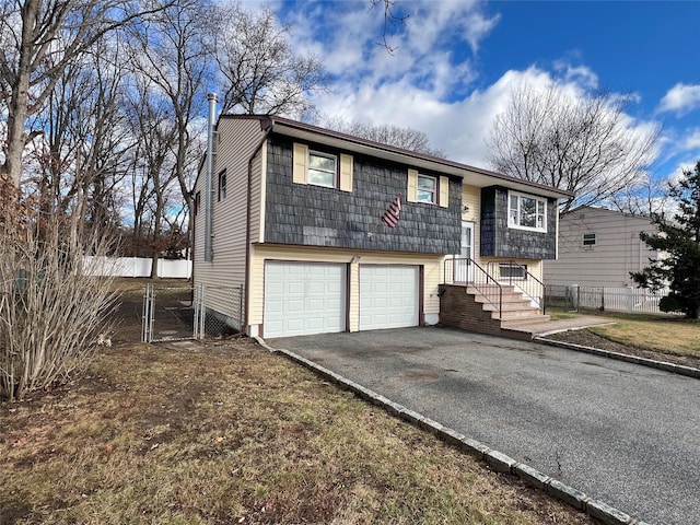 split foyer home featuring a garage