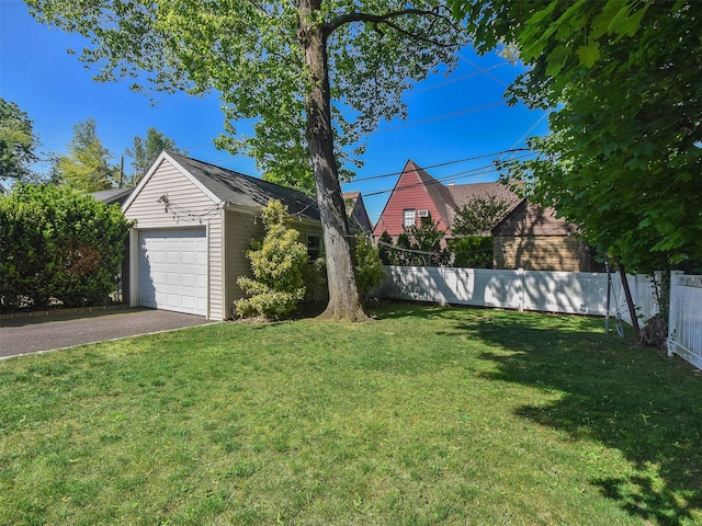 view of yard with a garage and an outdoor structure