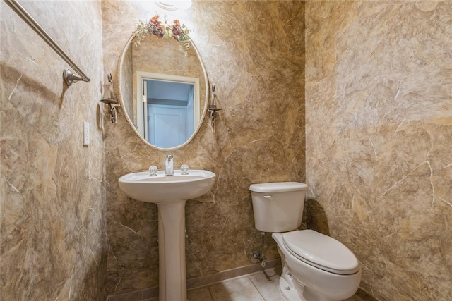 bathroom featuring tile patterned flooring and toilet