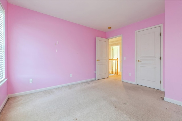 unfurnished bedroom with light carpet